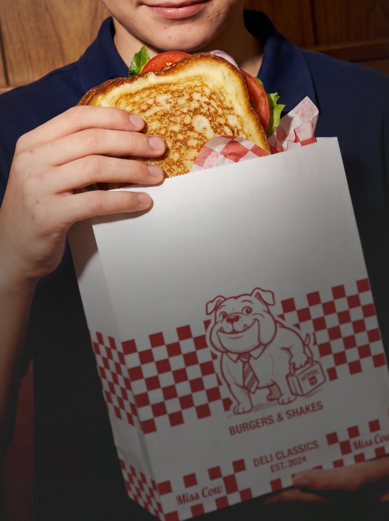Student holding a restaurant lunch ordered for school